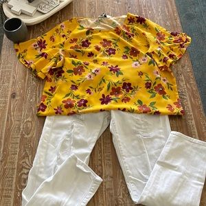 Yellow blouse with flowers and bell sleeves.  Beautiful with white pants/ jeans